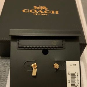 A pair of gold earrings